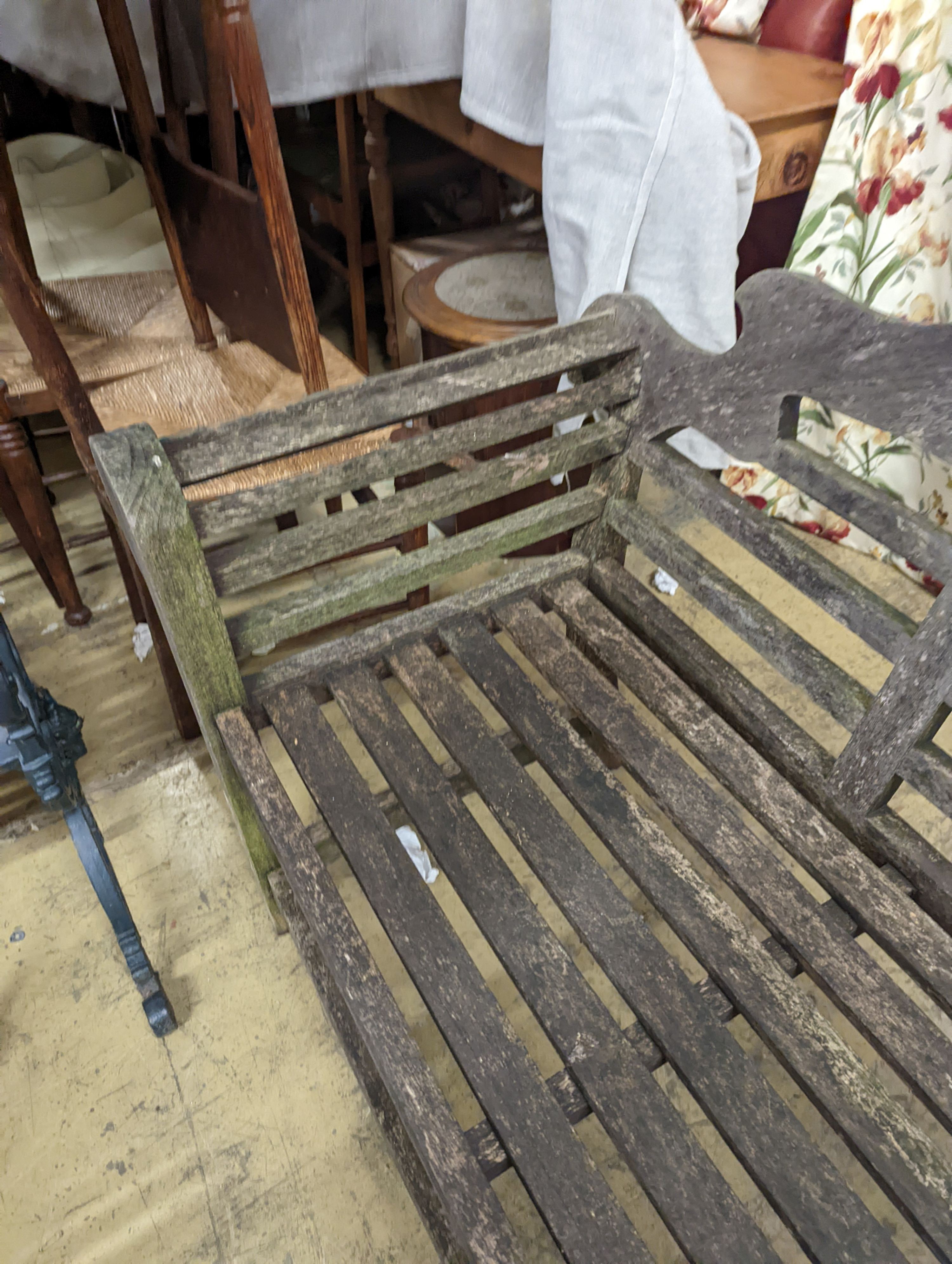 A pair of Lutyens style weathered teak garden benches, length 166cm, depth 53cm, height 105cm